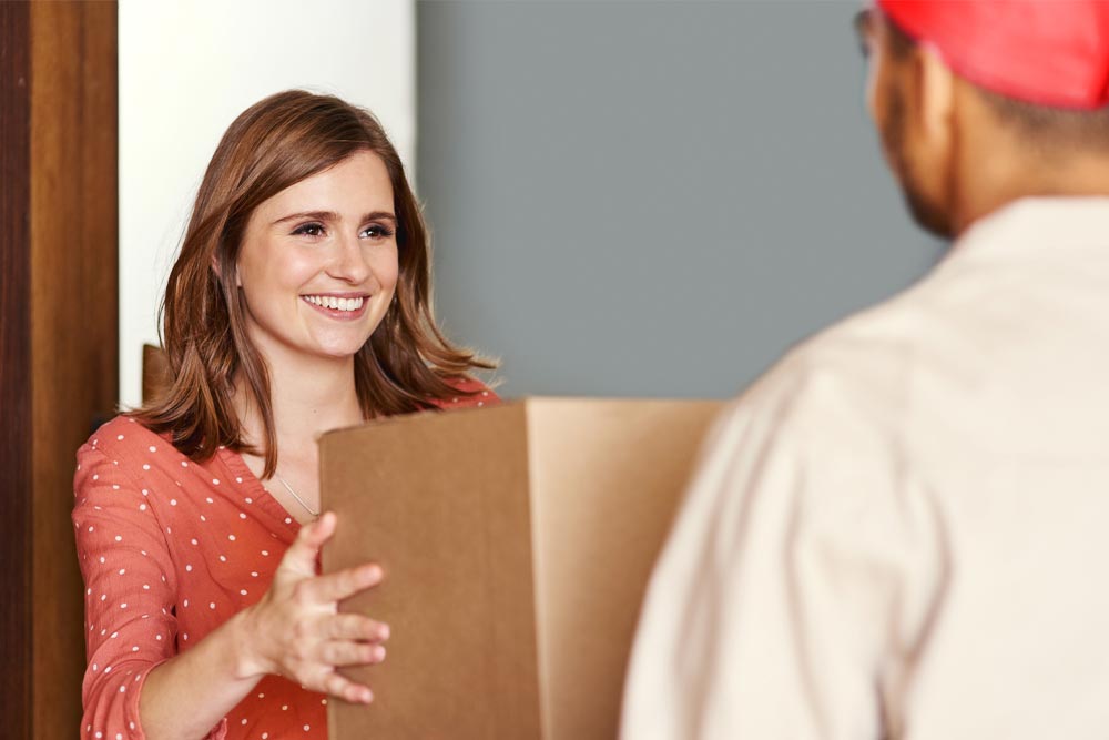 woman holding delivery box